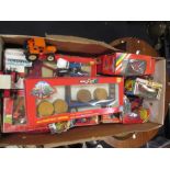 Britains model farm vehicles in boxes, including tractors and equipment (condition varies)