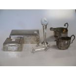 A collection of silver items including a sauceboat, cream jug, two cigarette boxes, a pair of