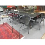 A modern iron work and granite garden table, 72 x 212 x 123cm & 8 chairs