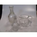 A pair of 19th century cut class decanters, of baluster form, the stoppers of segmented stoppers