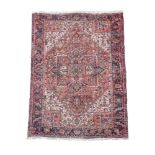 A Heriz pink, ivory and blue ground carpet, 400 x 292cm (157 x 115in)