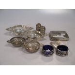 Four pierced silver bon bon dishes, a pair of open salts with liners and a pair of pepperettes, also