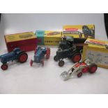 Britains model farm tractors, two in damaged boxes, and including a repainted pre-war green tipper