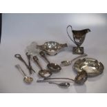 A pair of silver grape shears, together with a toddy ladle, a pair of berry spoons, a caddy spoon, a