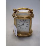 A French gilt brass carriage timepiece,