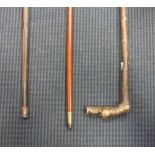 A gold mounted horn handles walking cane and a yellow metal mounted malacca cane and another (3)