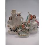 A large collection of Staffordshire figures including 'Burns & Mary', 'Napoleon', and two pairs of