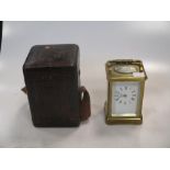 A brass cased carriage clock with case and key