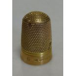 A 15ct gold thimble in leather case