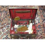 A Harrods crocodile skin travelling dressing case with part fluted interior together with a