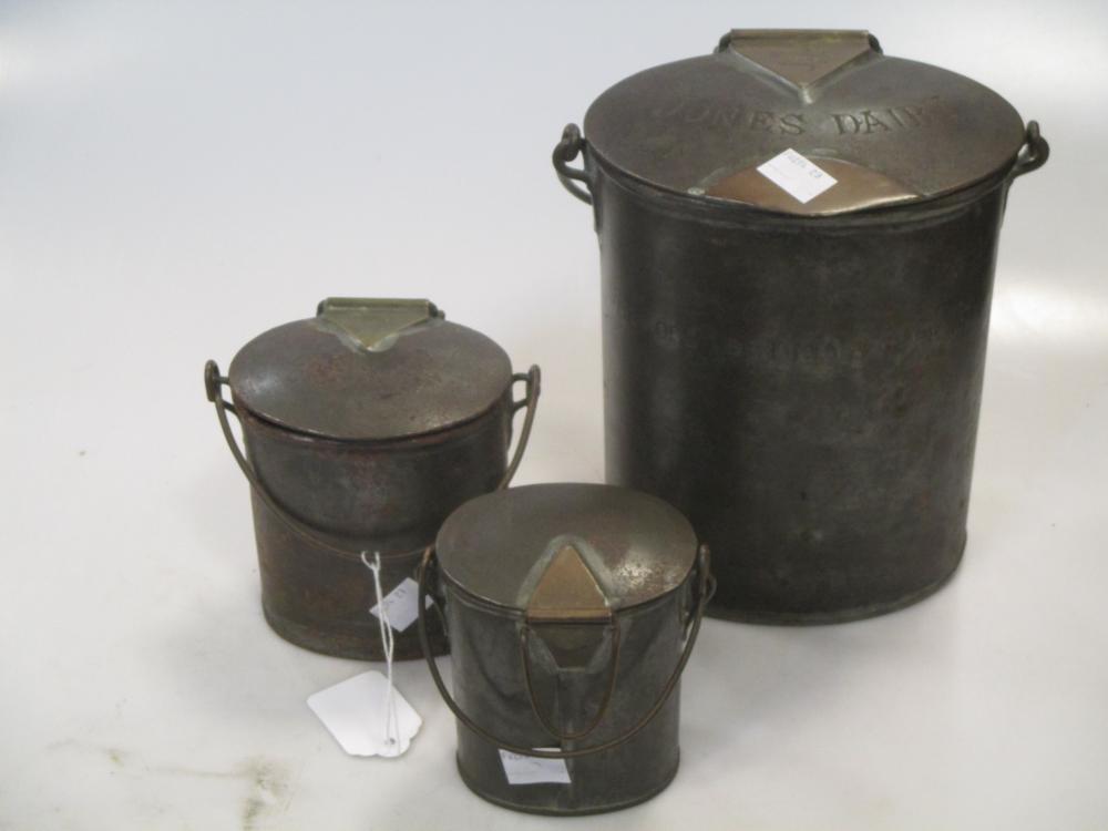 Three old brass mounted tin milk cans, named (3)