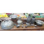 A late 17th or early 18th century style pewter jug, a collection of pewter spoons, bowls and other