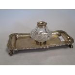 George III silver desk inkstand, with mounted glass inkwell, London, 1815, 22.5cm wide