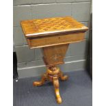 A late Victorian walnut and inlaid games table with fold-over top on carved legs, 77cm high