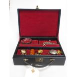 A travelling jewellery box containing a quantity of jewellery including an 18ct ring, four