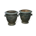A pair of 19th century cast iron urns, after the antique in the manner of J J Ducel et Fils finished