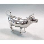 A German metalwares silver semi naturalistic cow creamer, of plain form, the hinged saddle with