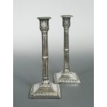 A pair of Victorian silver candlesticks, by Harrison Bros & Howson, Sheffield 1890, the square