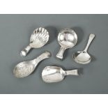 A collection of four George III and one George IV silver caddy spoons, by Elizabeth Morley, London