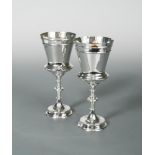 A pair of Victorian silver goblets, by Frederick Elkington, Birmingham 1871 & 1873, each with a