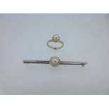 A diamond and bouton cultured pearl bar brooch together with a cultured pearl ring, the white on