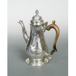 A George III silver coffee pot, by William Cripps, London 1762, the tapered baluster body embossed