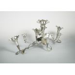 A silver plated Art Nouveau style table centrepiece, composed of swirling tendrils and vine leaves