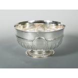 A Victorian silver punchbowl, by Charles Stuart Harris, London 1890, half gadrooned, with a