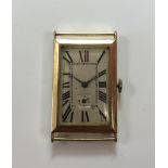 An Art Deco 18ct gold gentleman's wristwatch head, circa 1923, the unsigned rectangular silvered
