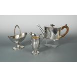 A Victorian silver three piece tea set, by Robert Harper, London 1874, the teapot of straight