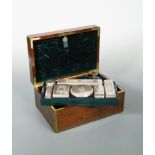 A William IV plum mahogany and brass bound gentleman's dressing case, containing a removable tray