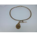 A 9ct gold double albert watch chain and pendant medal, the graduated curb link chain with lobster