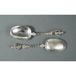 A pair of continental metalwares short handled serving spoons, marks not traced, probably Dutch,