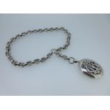 A Victorian collar chain and pendant locket, the chunky anchor link chain meeting at the front in