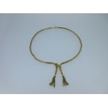 An Italian fancy link negligee necklace, the chain a form of fancy snake links, joined at the