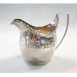 A George III silver cream jug, maker's mark partly erased, but probably by the Batemans, London