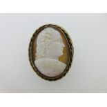 A shell cameo brooch depicting the portrait of a gentleman, possibly a poet or playwright, with