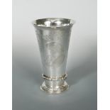 A Dutch metalwares large beaker, of tall tapering form with flared rim, the sides decorated with