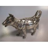 A German metalwares silver naturalistic cow creamer, by Johann S Kurz & Co, Hanau, the detailed cast