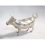A continental metalwares semi-naturalistic cow creamer, indistinctly marked to the belly, possibly