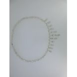 A moonstone set fringe necklace, the front section a fringe graduating from 1.5cm to 3.5cm of claw