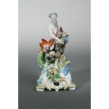 An 18th century Bow figure of Neptune, circa 1755-60, standing holding a jar issuing water with a