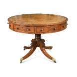 A Regency mahogany drum top library table, the leather lined top with four drawers and alternate