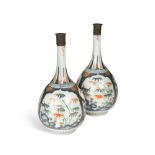 A pair of Japanese Arita porcelain bottle vases, Edo period, early 18th century, painted in