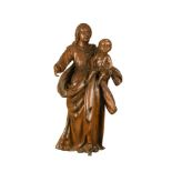 An 18th century carved walnut figure of the Madonna and Child, 86cm (34in) Old repairs