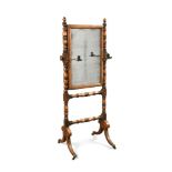 A Regency mahogany cheval dressing mirror, on ring turned supports with brass candle holders 140 x