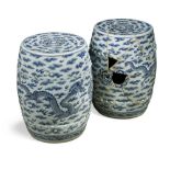A pair of Chinese blue and white garden seats, 19th century, of barrel shaped form moulded with stud