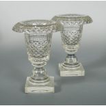 A pair of Irish 19th century 'hobnail' cut glass vases, with fold over rims, the tapering bodies