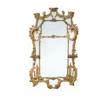 A 19th century George II style gilt composition framed wall mirror, with divided central plate, C-
