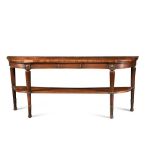 A Regency mahogany bow fronted serving table, with inverted centre and undertier, on leaf carved